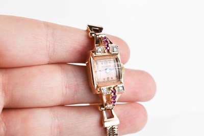 Lot 3 - A 14ct rose gold, diamond and ruby Helbros...