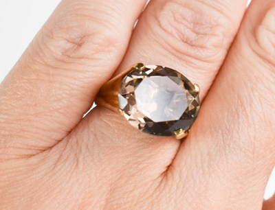 Lot 5 - A 9ct gold and smokey quartz ring, the single...