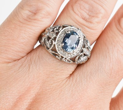 Lot 7 - A 14ct white gold, blue stone and diamond ring,...