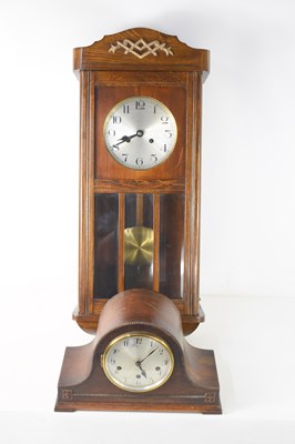 Lot 385 - A mid century oak cased wall clock and a...