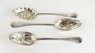 Lot 415 - Three George III berry spoons, comprising two...