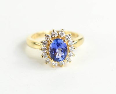 Lot 242 - A 14ct gold, tanzanite and diamond ring, the...