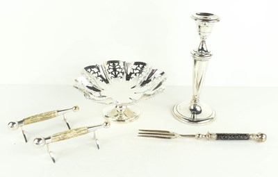 Lot 386 - A silver candlestick with weighted base, a...