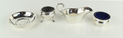 Lot 394 - A small silver sauce boat with scalloped rim...