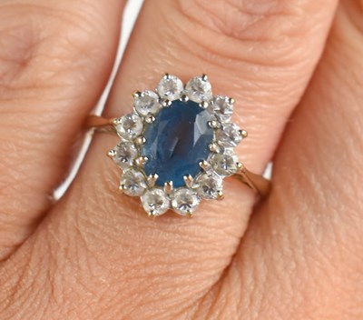 Lot 236 - A 9ct gold dress ring set with blue and white...