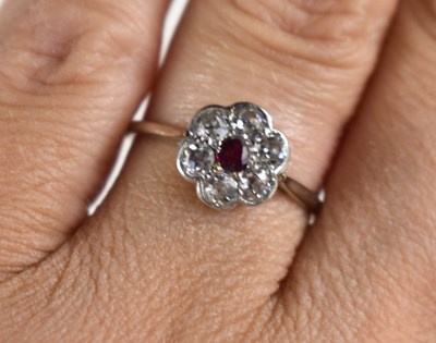 Lot 241 - A white gold, diamond and ruby flowerhead ring,...