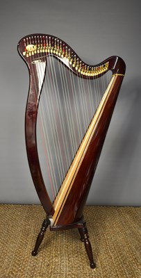 Lot 301a - A modern Aoyama 34 lever harp, raised on three...