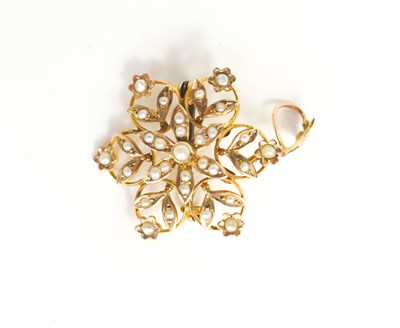 Lot 136 - A 9ct gold and seed pearl pendant / brooch, of...