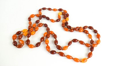 Lot 289 - A double strung set of amber beads, the...