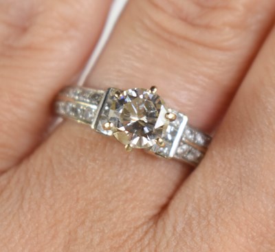 Lot 216 - An 18ct white gold and diamond solitaire ring,...