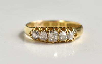 Lot 208 - An 18ct gold, and diamond five stone ring, the...