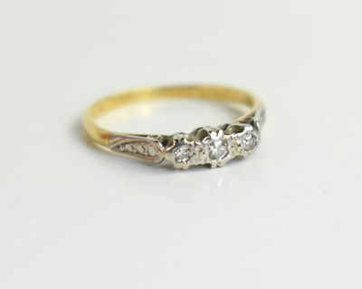 Lot 132 - An 18ct gold, platinum and diamond three stone...