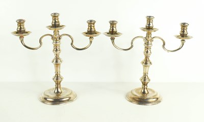 Lot 428 - A pair of silver small size candelabra, each...