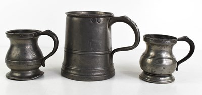 Lot 157 - A group of three 19th century pewter tankards,...