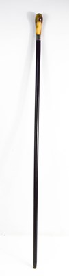 Lot 194 - A horn, ebonised and silver topped fine cane,...