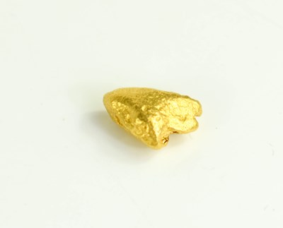 Lot 291 - A solid gold nugget, testing to at least 18ct...