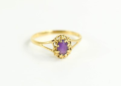 Lot 131 - An 18ct gold and amethyst ring, size O, 1.8g.