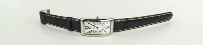 Lot 254 - A Longines curved rectangular cased wristwatch...