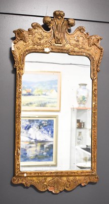 Lot 279 - A 19th century gilt gesso wall / pier mirror,...