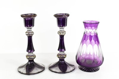 Lot 33 - A pair of Victorian purple glass candlesticks,...