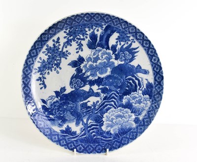 Lot 69 - A Chinese blue and white dish / charger, circa...