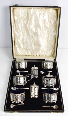 Lot 203 - A silver plated twin cruet set, in the...