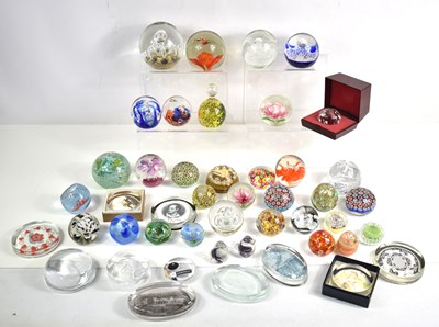 Lot 145 - A large collection of glass paperweights to...