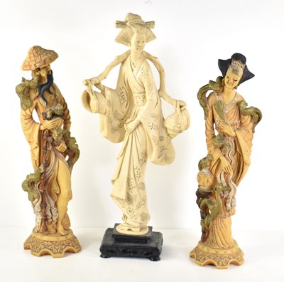 Lot 88 - Three Oriental resin figurines to include one...