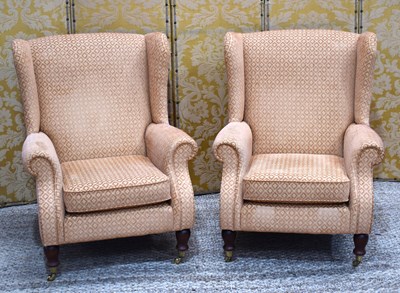 Lot 444 - A pair of Parker Knoll armchairs raised on...