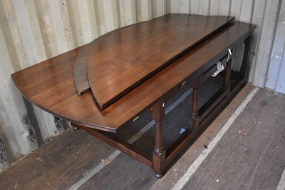 Lot 454 - A 20th century mahogany drop leaf dining table...