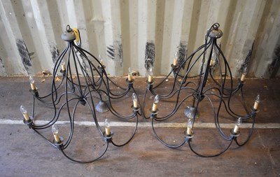 Lot 274 - A pair of metalwork eight branch chandeliers,...