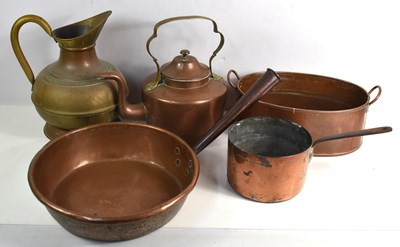 Lot 251 - A group of copper ware to include cooking pans,...