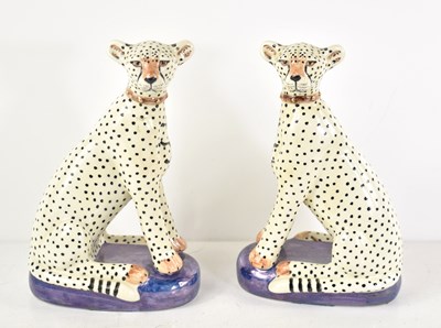 Lot 45 - A pair of hand painted pottery cheetahs by...