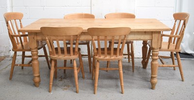 Lot 443 - An antique pine kitchen table with planked top,...