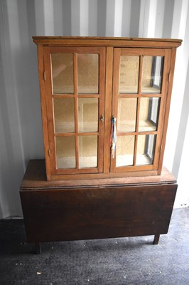 Lot 421 - An antique pine display cabinet, the two...