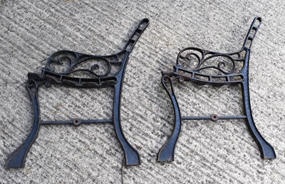 Lot 428 - A pair of black painted cast iron garden bench...