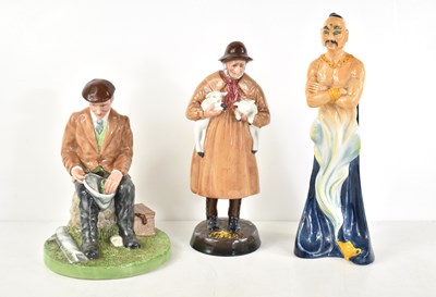 Lot 35 - Three Royal Doulton ceramic figures comprising...