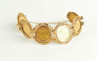 Lot 219 - A 9ct gold and six sovereign set bracelet,...