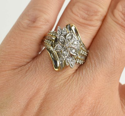 Lot 157 - A 9ct gold and diamond cluster ring, the...