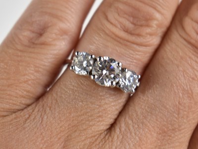 Lot 220 - An 18ct white gold and diamond trio ring, the...