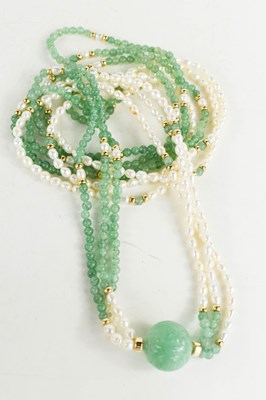 Lot 56 - A Chinese jade and pearl double strand...