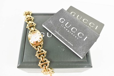 Lot 255 - A Gucci watch, with mother of pearl dial, the...