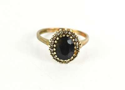 Lot 130 - A 9ct gold, sapphire and diamond ring, the...