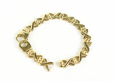 Lot 187 - A 9ct gold bracelet, composed of X form links,...