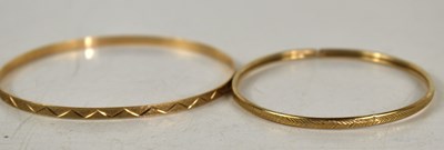 Lot 133 - A 9ct gold bangle, with matt finish and...