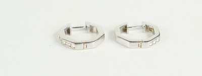 Lot 83 - A pair of 9ct white gold and diamond earrings,...