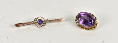 Lot 282 - A 9ct gold and amethyst set bar brooch,...