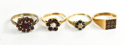 Lot 283 - Three 9ct gold rings, two set with garnet, one...