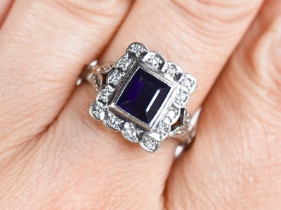 Lot 20 - A white gold, sapphire and diamond ring, the...