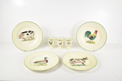 Lot 76 - A set of four Heron Cross pottery plates...